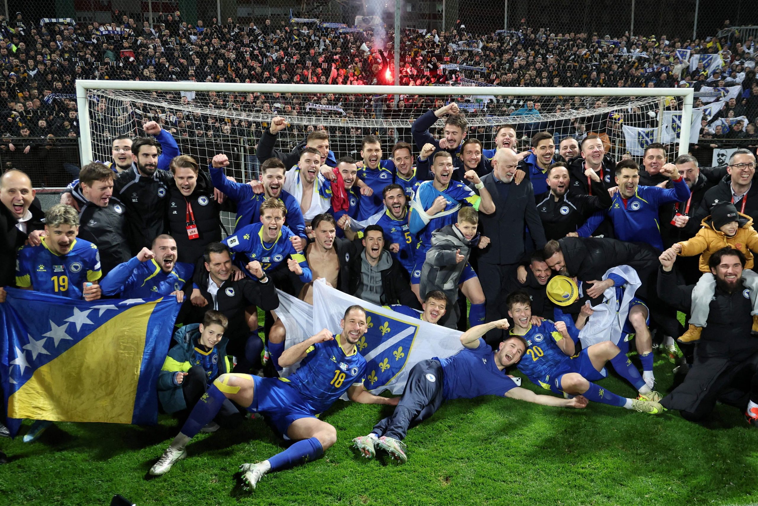 Bosnia players celebrating World Cup qualification after beating Italy in Zenica